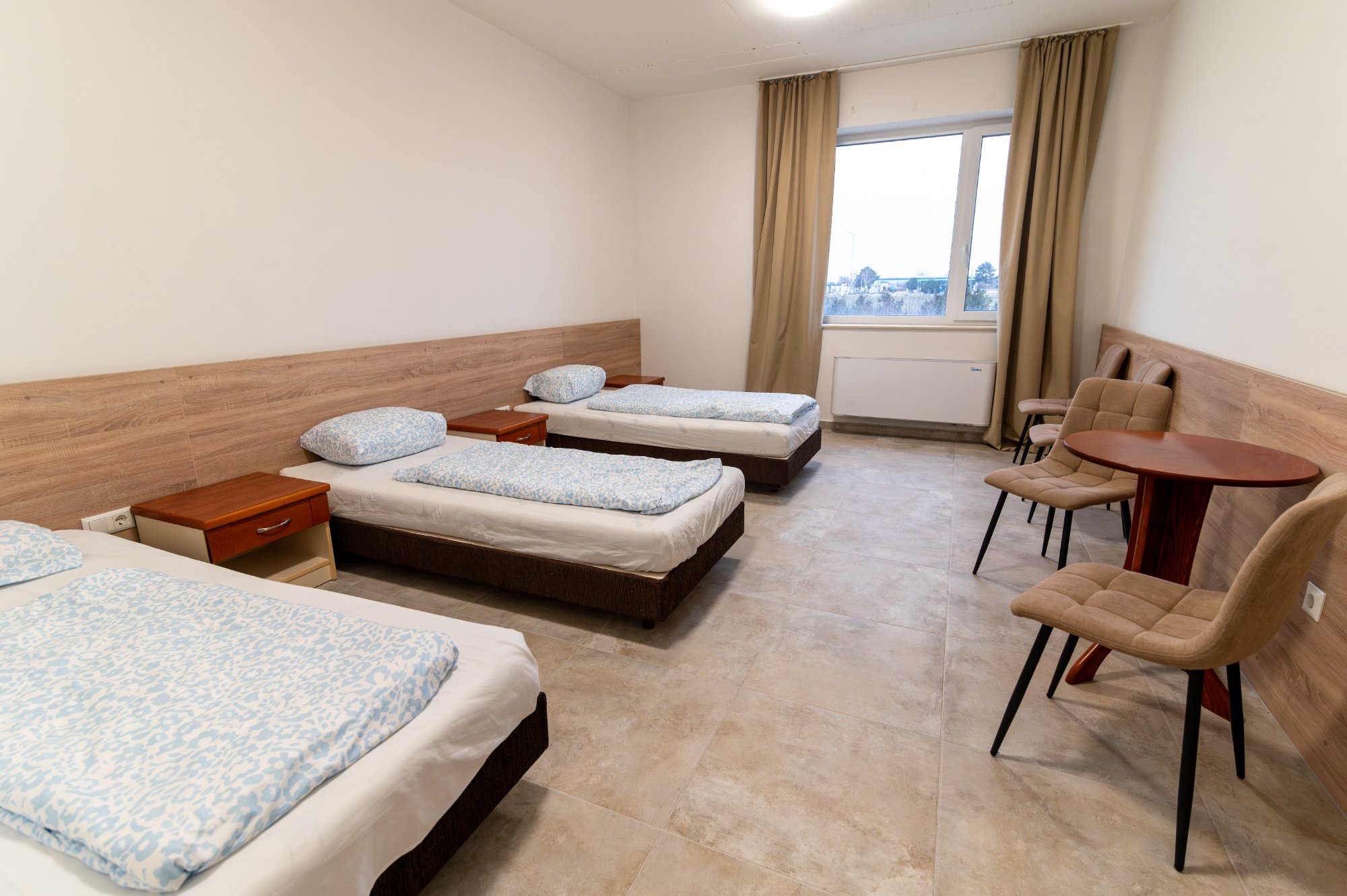 MoveInn Home szoba - tágas, modern hálószoba